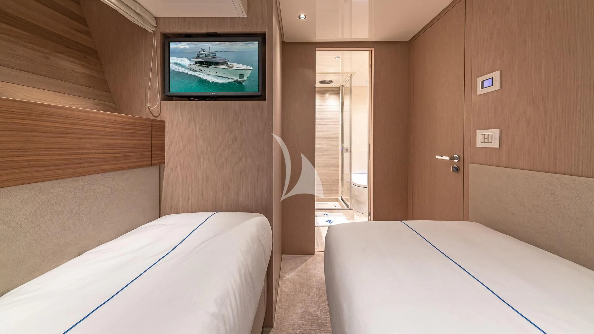 a room with beds and a television aboard NO MATTER WHAT Yacht for Charter