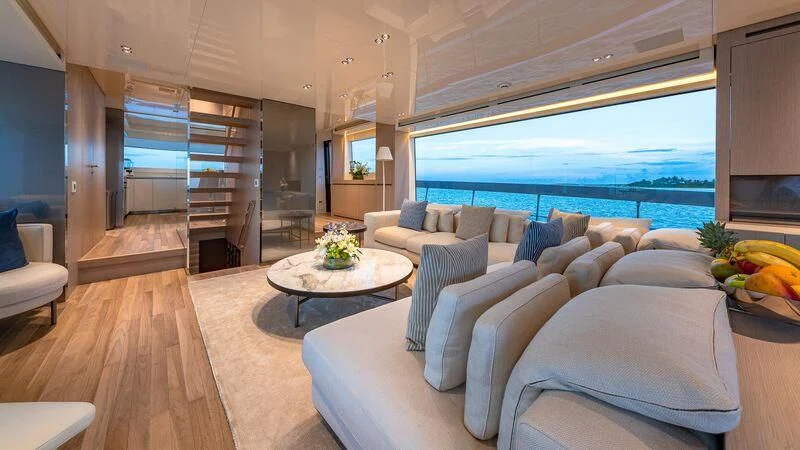 a living room with a large window aboard NO MATTER WHAT Yacht for Charter