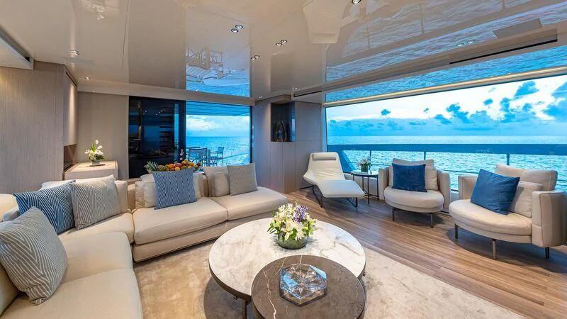 a living room with a large window aboard NO MATTER WHAT Yacht for Charter