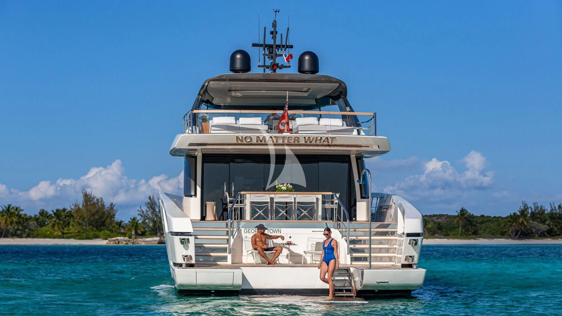 a boat on the water with Thomas Point Shoal Light in the background aboard NO MATTER WHAT Yacht for Charter