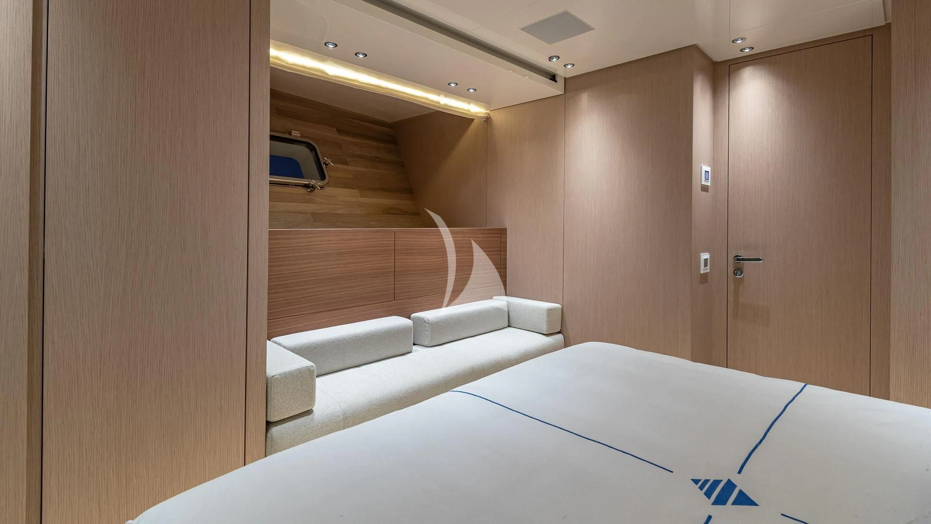 a room with a bed and a closet aboard NO MATTER WHAT Yacht for Charter