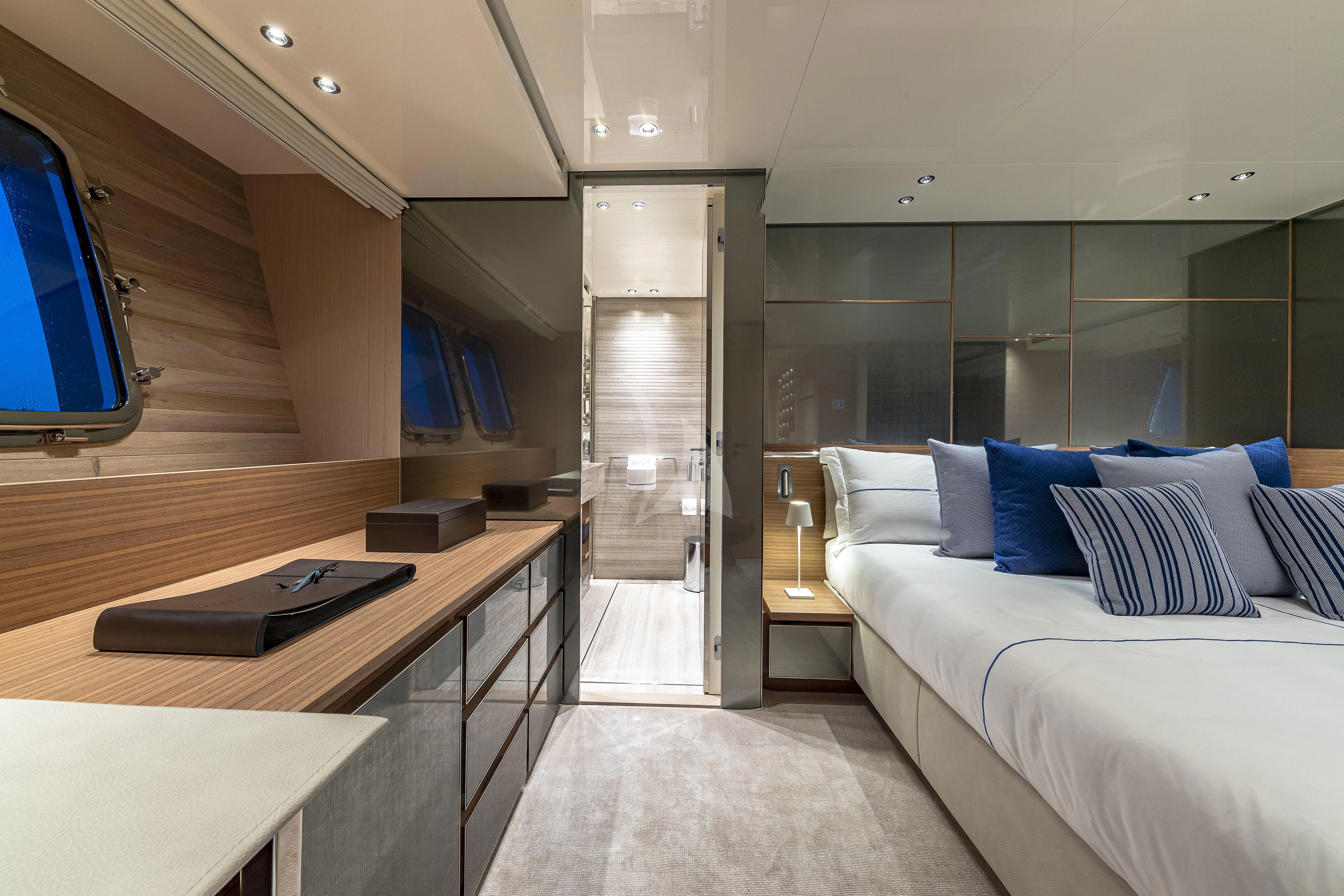 a room with a bed and a desk aboard NO MATTER WHAT Yacht for Charter
