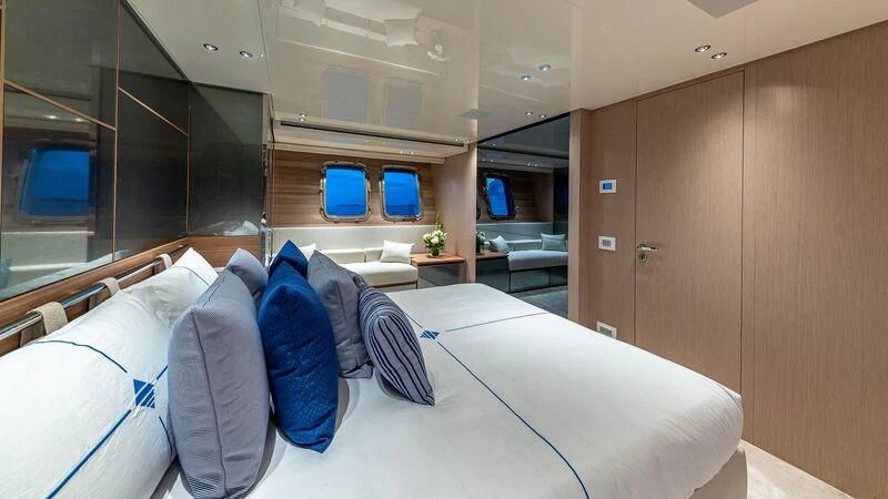 a room with a bed and a desk aboard NO MATTER WHAT Yacht for Charter