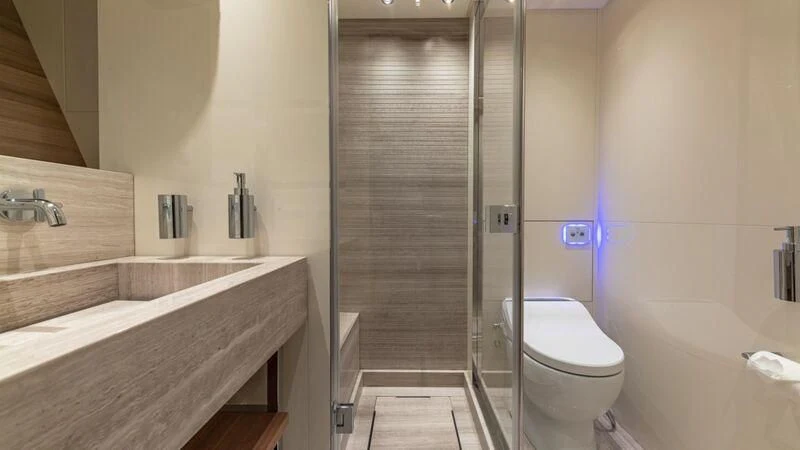 a bathroom with a shower unit and sink aboard NO MATTER WHAT Yacht for Charter