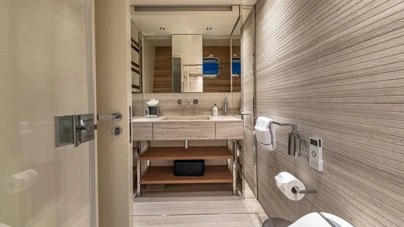 a bathroom with a sink and a mirror aboard NO MATTER WHAT Yacht for Charter