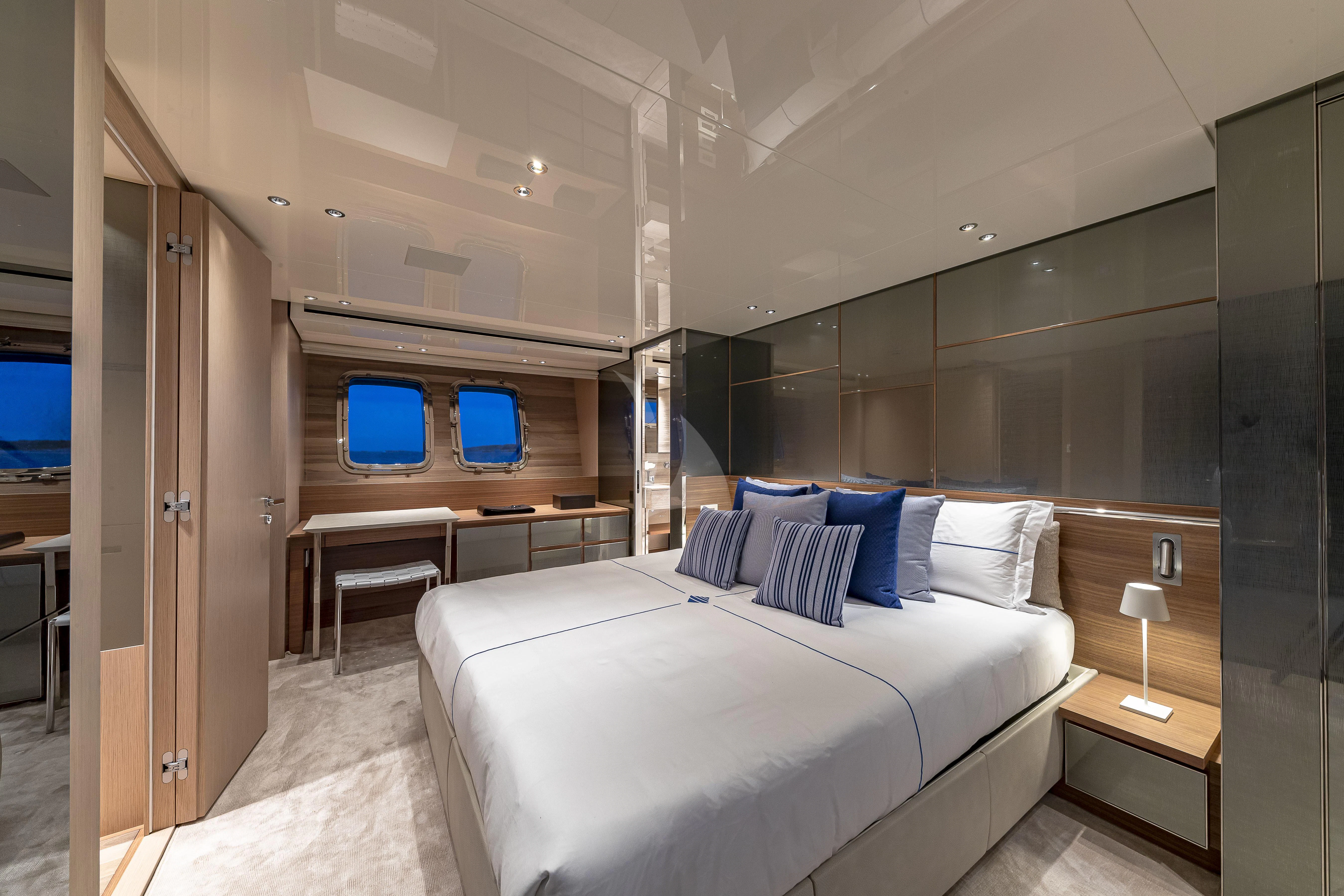a room with a bed and desk aboard NO MATTER WHAT Yacht for Charter