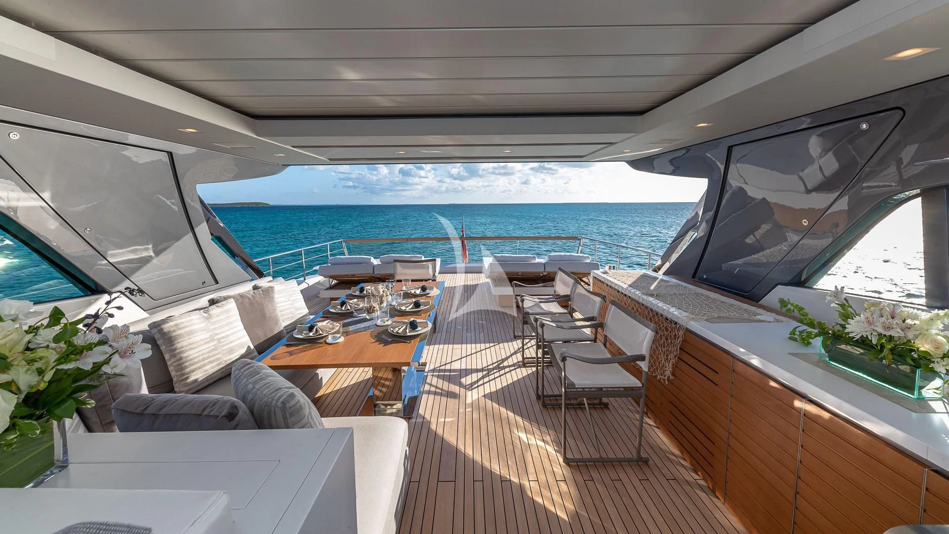 a boat with a table and chairs aboard NO MATTER WHAT Yacht for Charter
