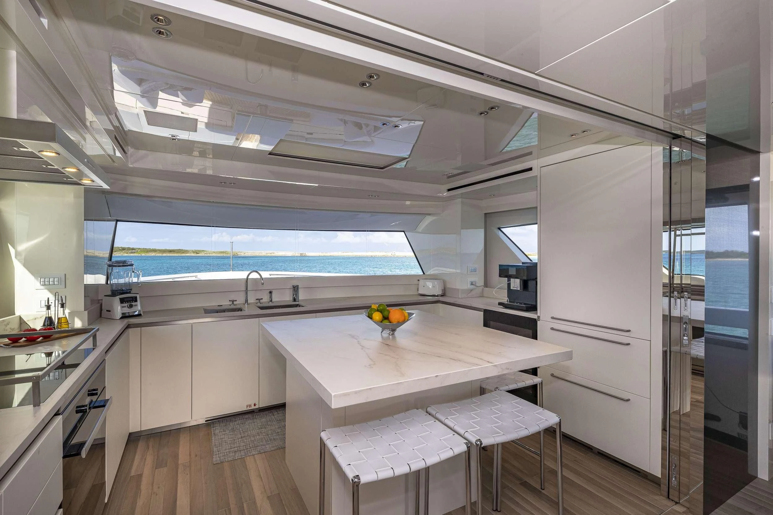 a kitchen with a table and chairs aboard NO MATTER WHAT Yacht for Charter