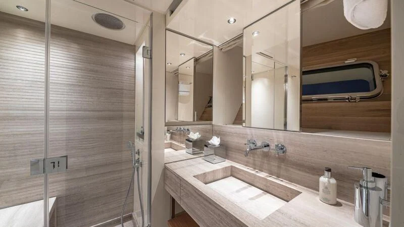 a bathroom with a sink and a mirror aboard NO MATTER WHAT Yacht for Charter