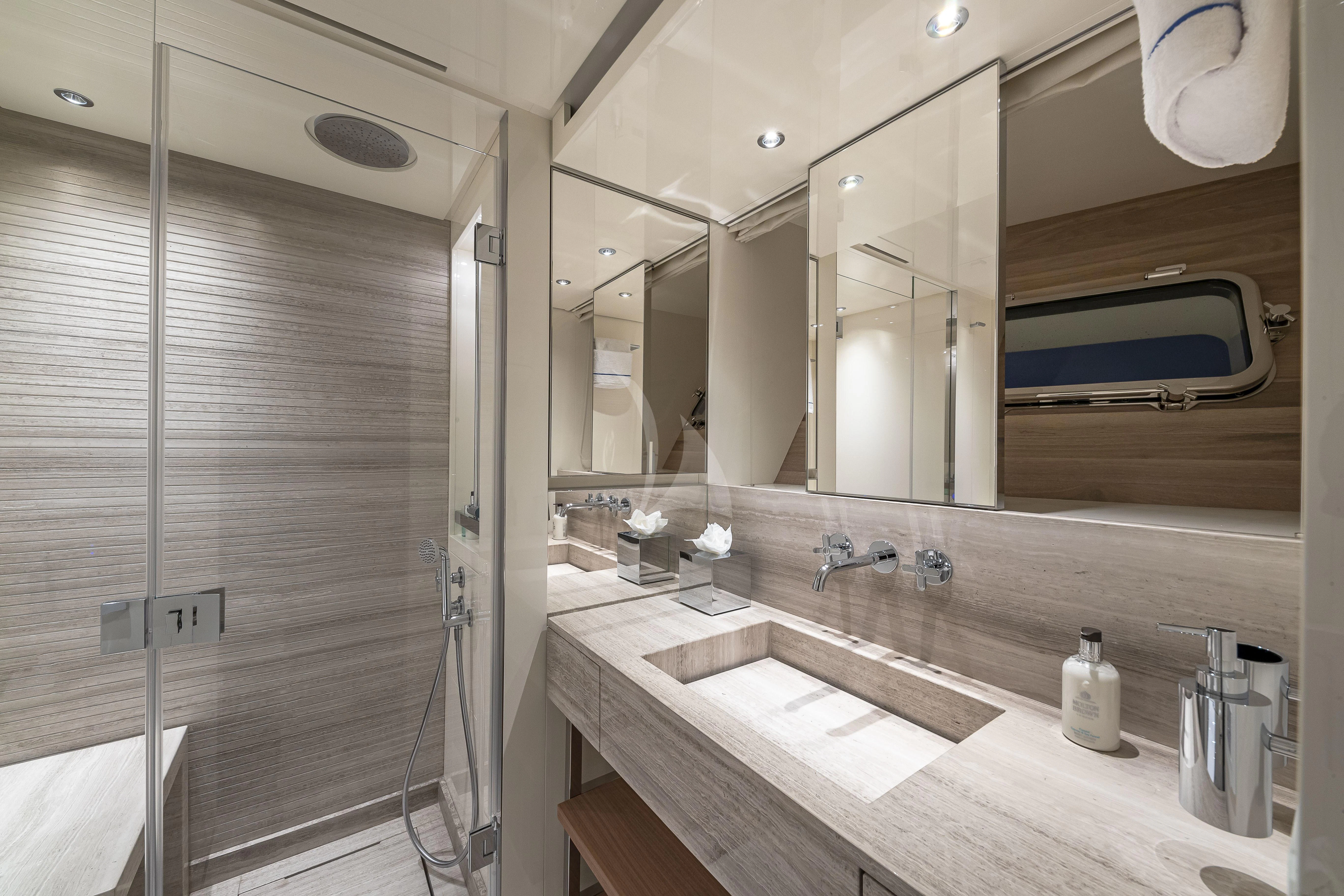 a bathroom with a shower unit and sink aboard NO MATTER WHAT Yacht for Charter