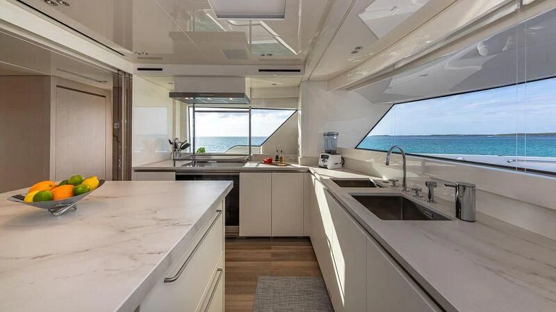 a kitchen with white cabinets aboard NO MATTER WHAT Yacht for Charter
