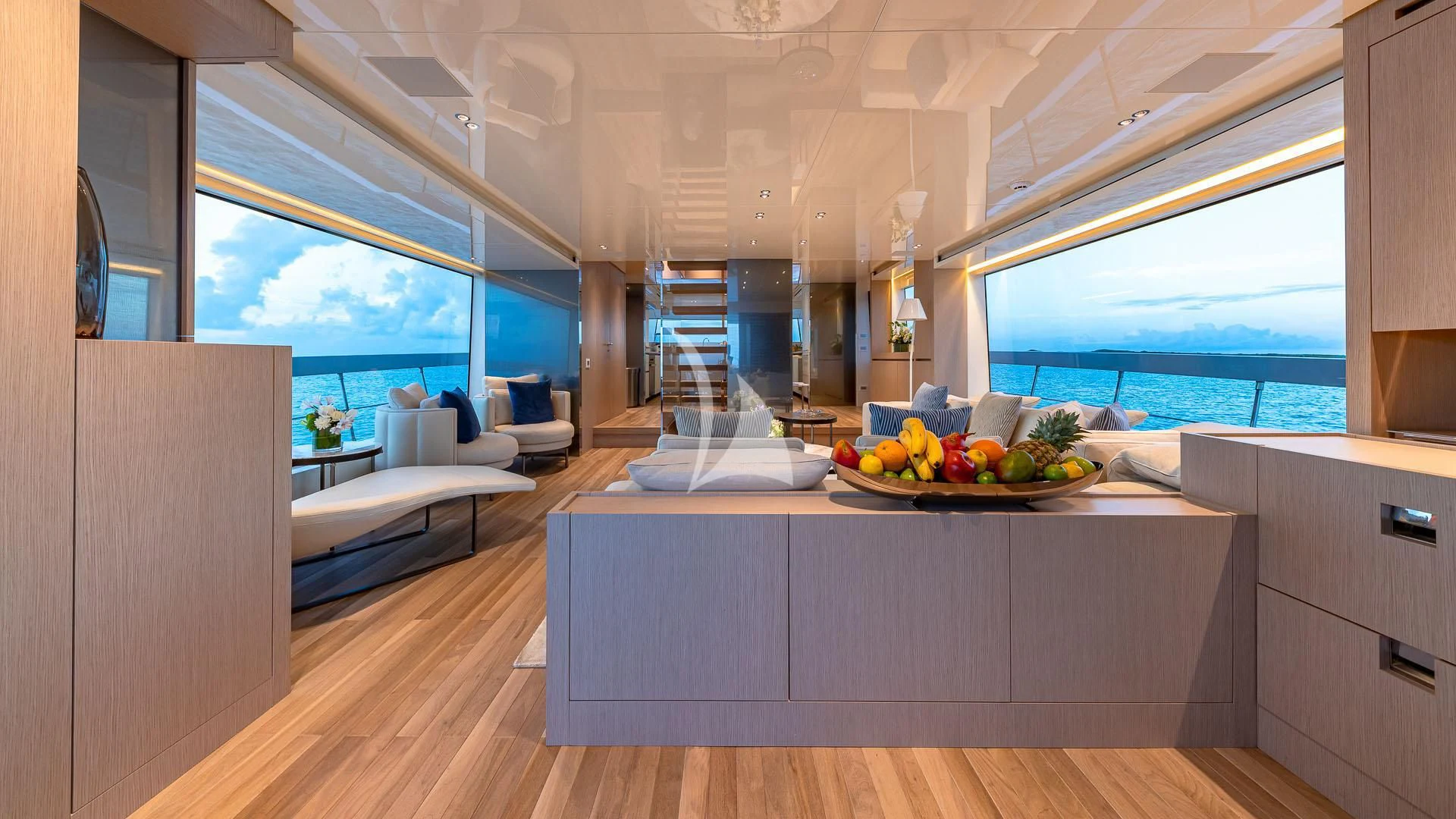 a kitchen with a table and a bed aboard NO MATTER WHAT Yacht for Charter