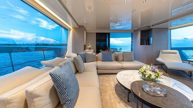a living room with a large window aboard NO MATTER WHAT Yacht for Charter