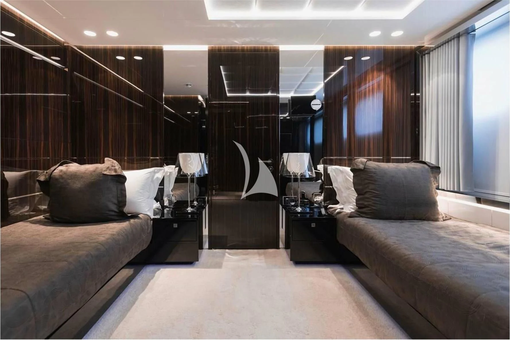a room with a bed and a desk aboard PEARL Yacht for Sale