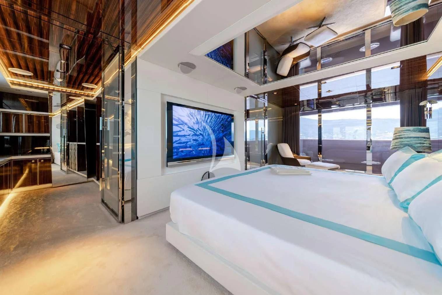a room with a bed and a tv aboard PEARL Yacht for Sale