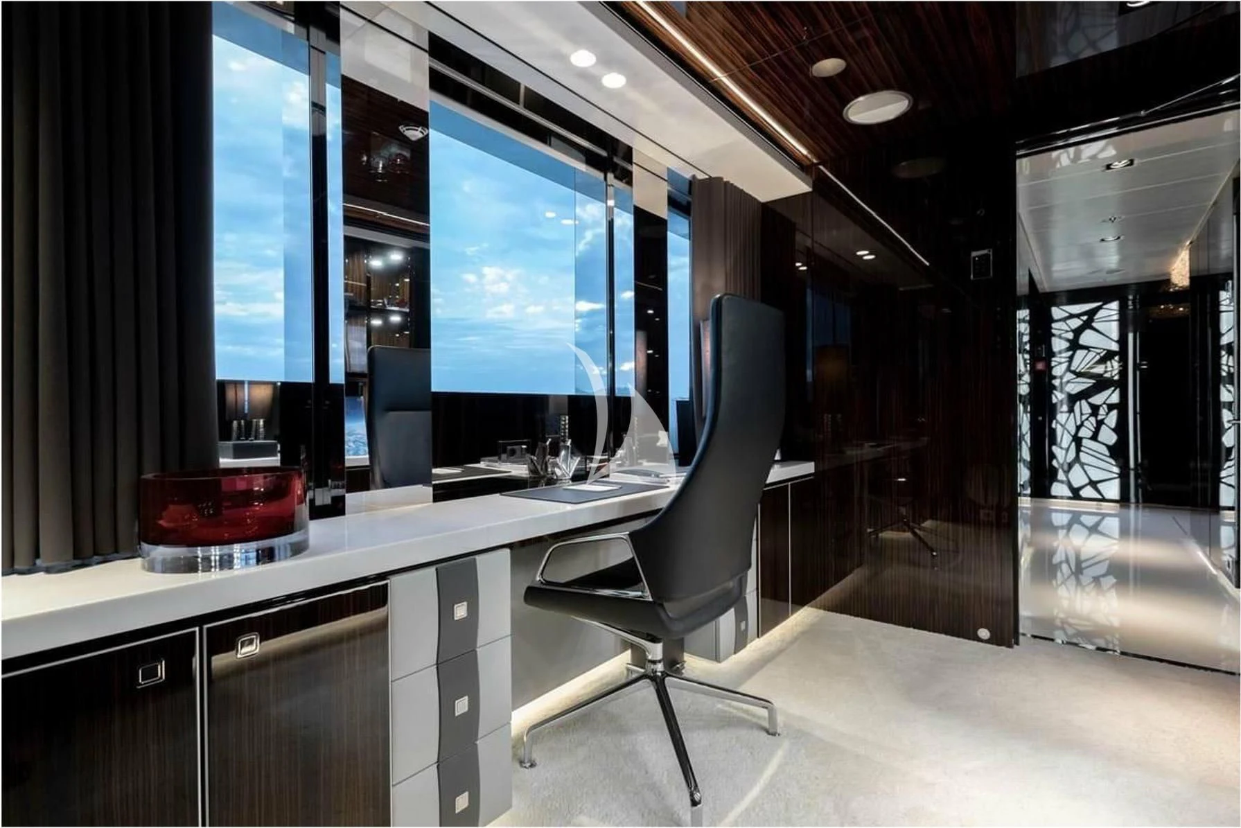 a room with a desk and a chair aboard PEARL Yacht for Sale
