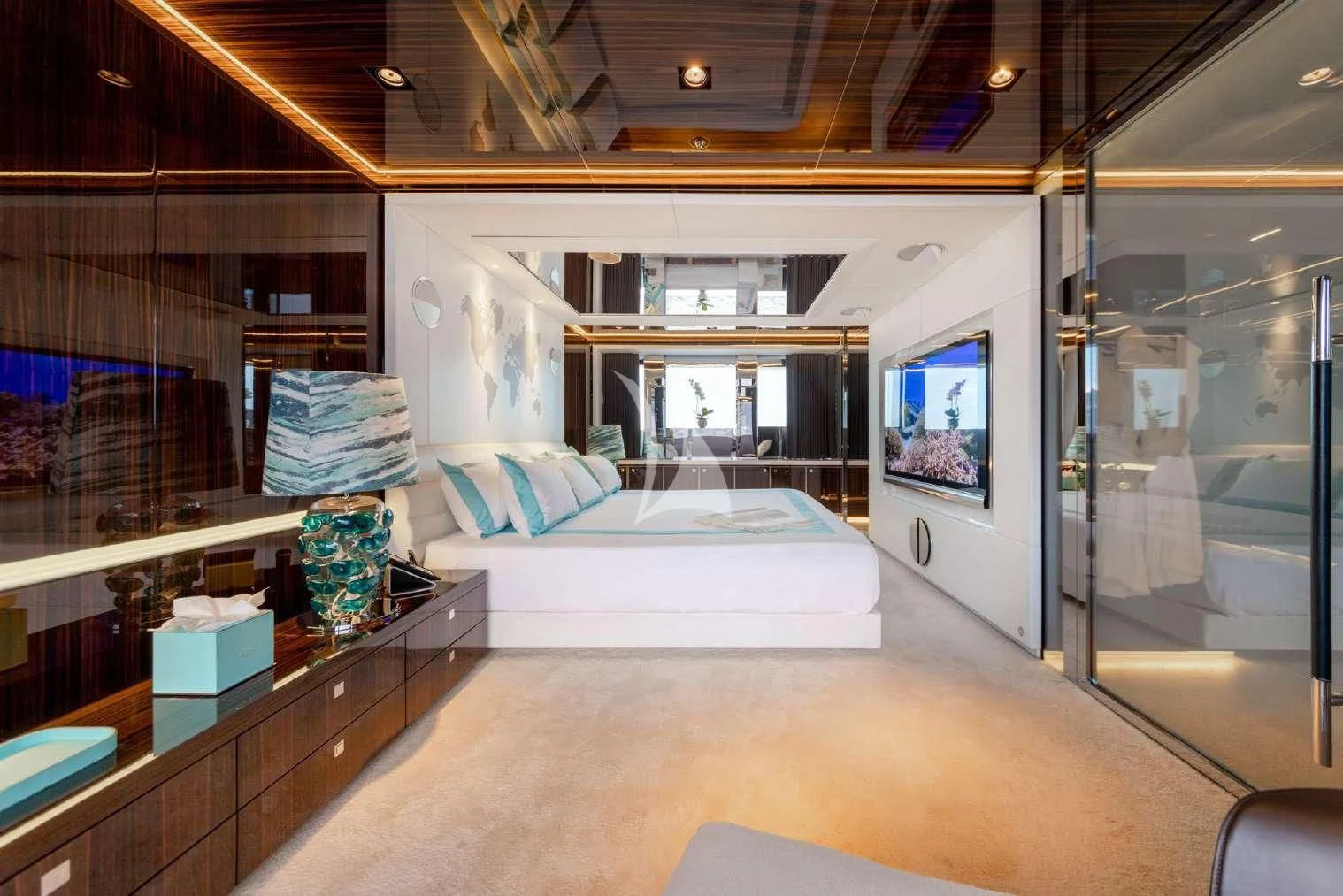 a room with a bed and a desk aboard PEARL Yacht for Sale