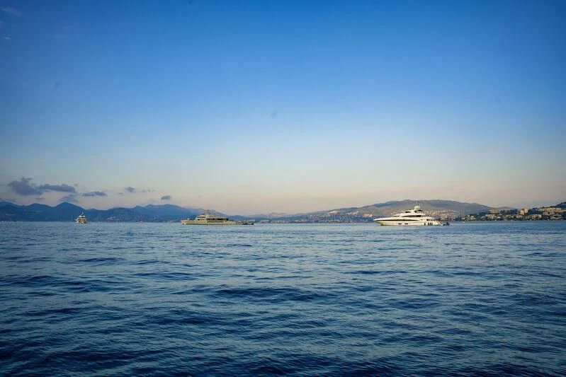 a body of water with a mountain in the distance aboard PEARL Yacht for Sale