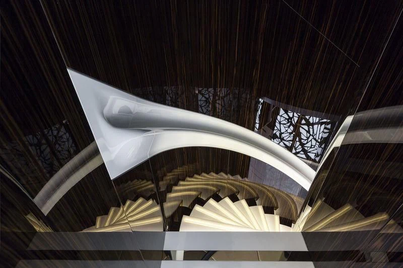 a staircase with a glass railing aboard PEARL Yacht for Sale