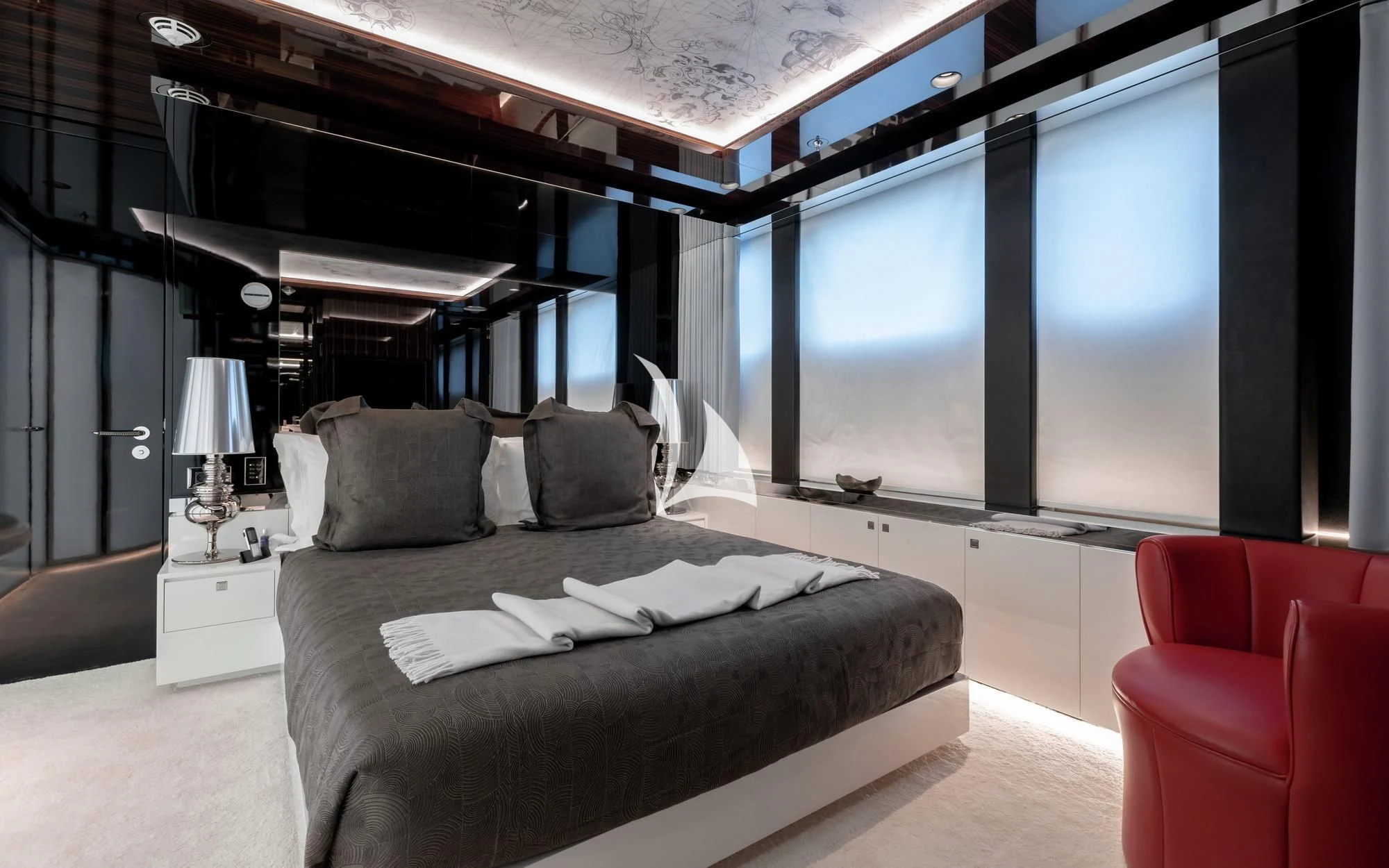 a room with a bed and a window aboard PEARL Yacht for Sale