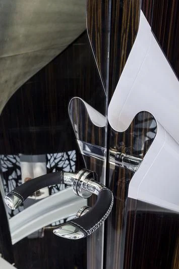 a white umbrella on a stand aboard PEARL Yacht for Sale
