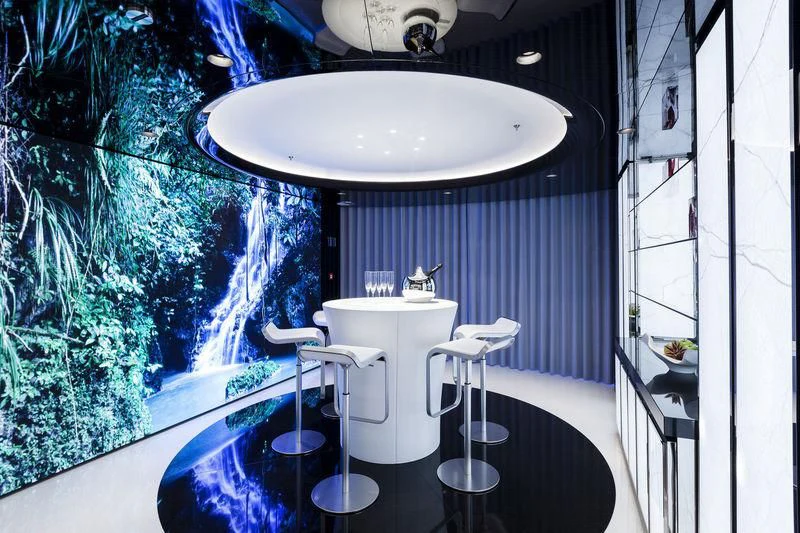 a bathroom with a large round mirror aboard PEARL Yacht for Sale