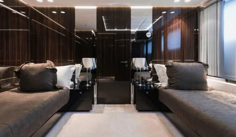 a room with beds and a bed aboard PEARL Yacht for Sale