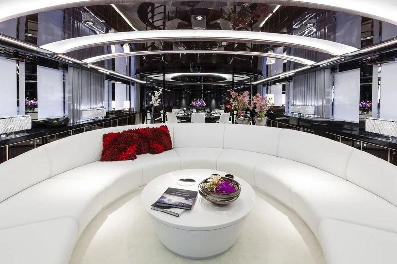 a white couch with a coffee table aboard PEARL Yacht for Sale