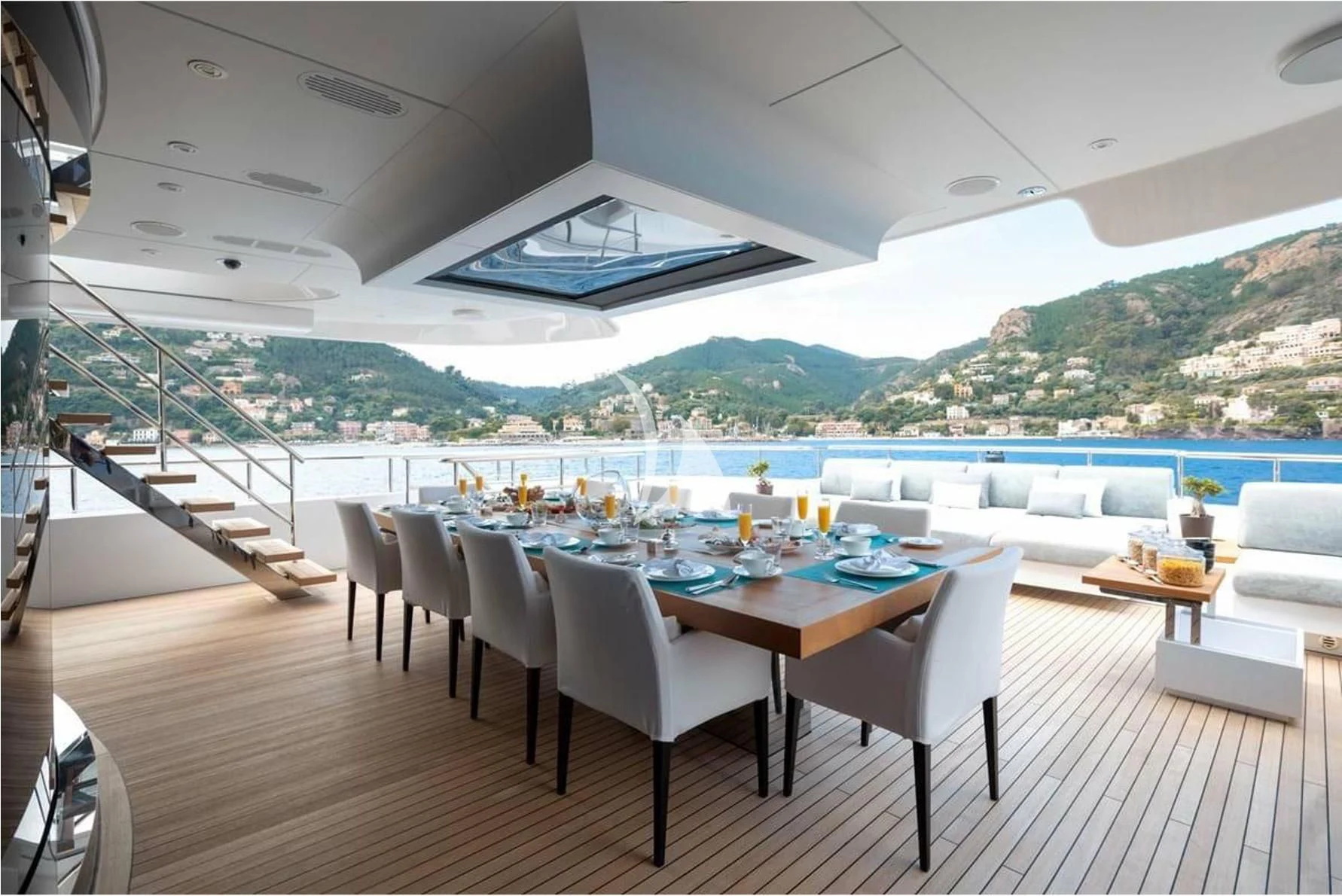 a room with a table chairs and a pool aboard PEARL Yacht for Sale