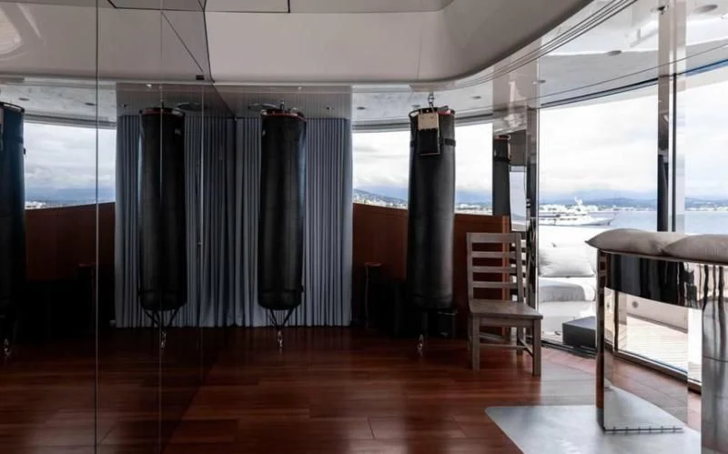 a room with a table and chairs aboard PEARL Yacht for Sale