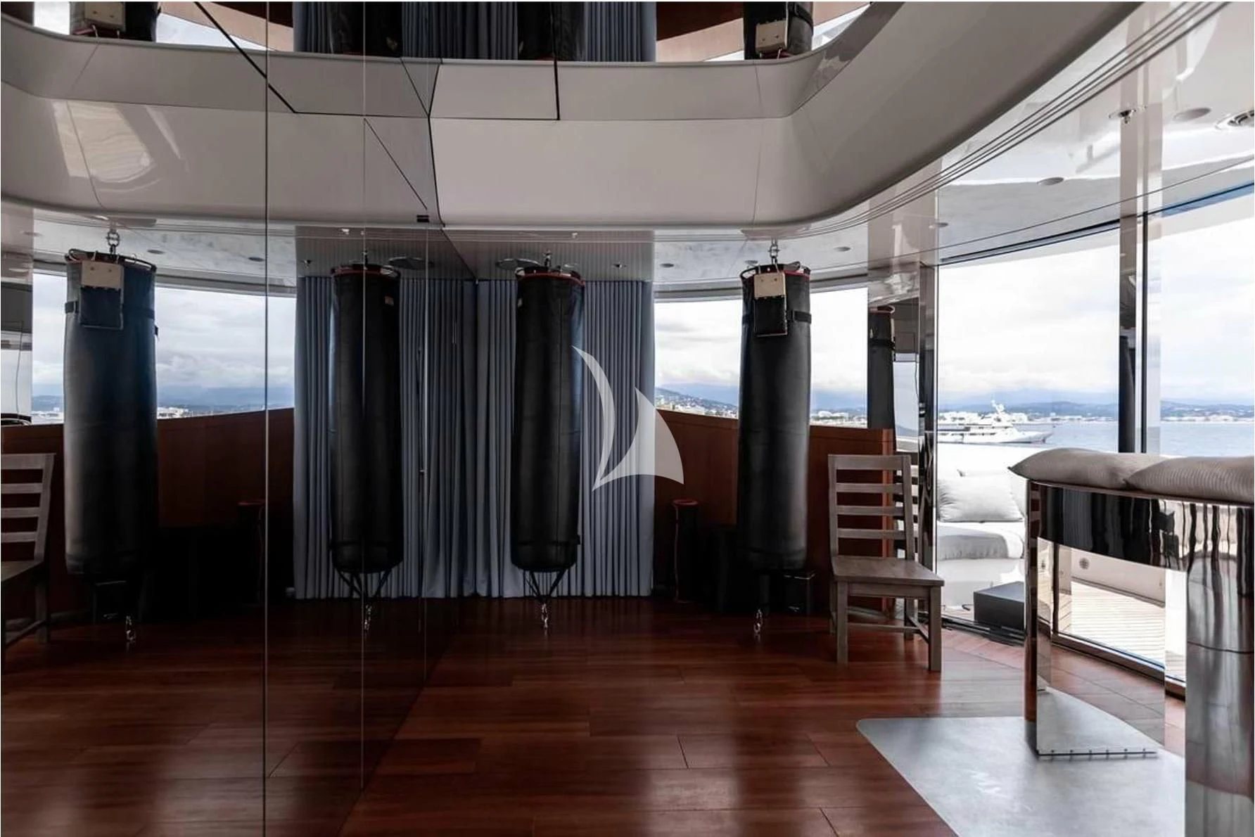 a room with a table and chairs aboard PEARL Yacht for Sale