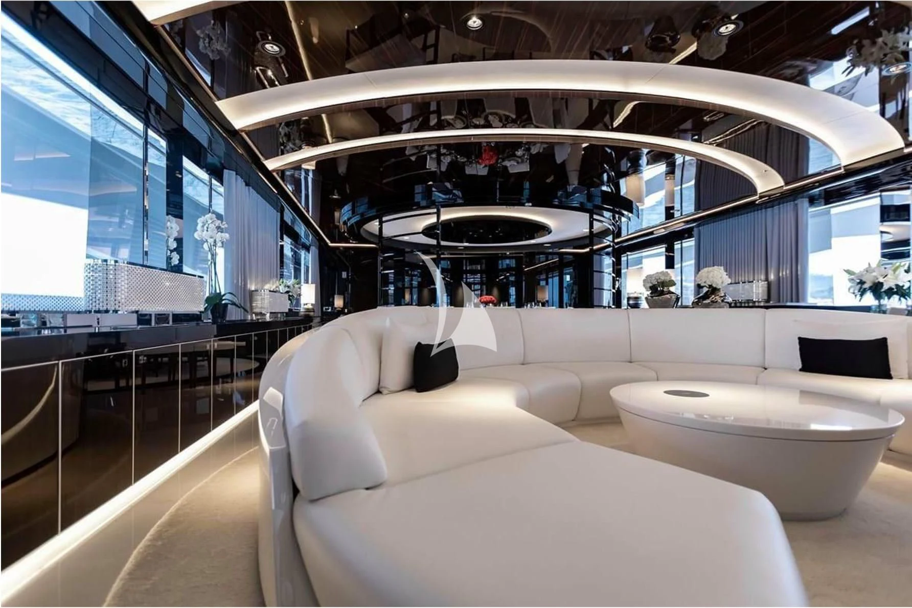 a room with couches and a table aboard PEARL Yacht for Sale