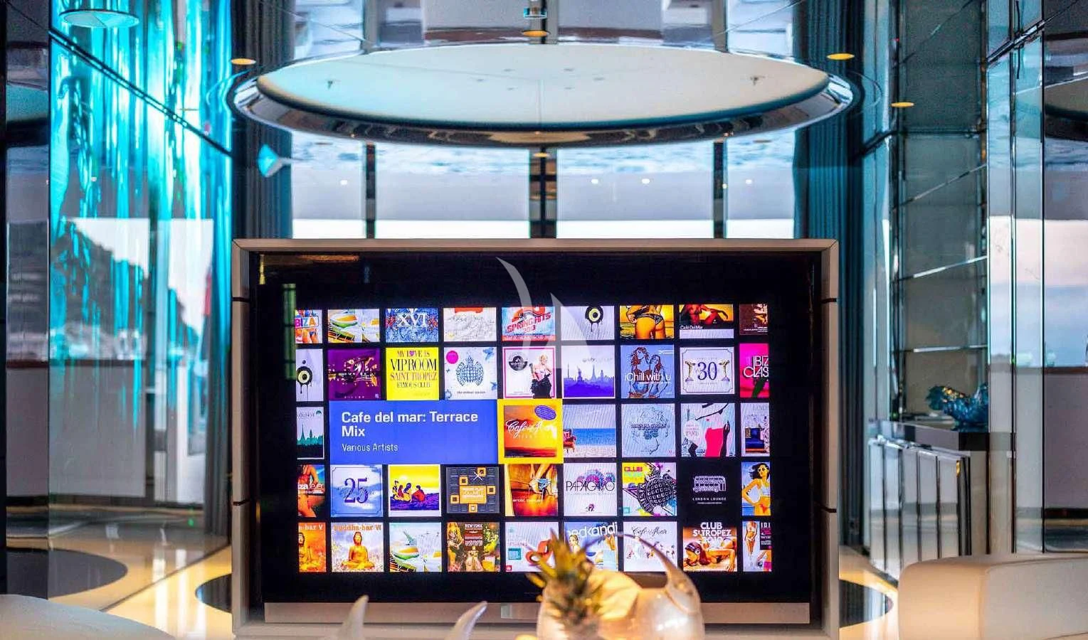 a black and blue display case with pictures on it aboard PEARL Yacht for Sale