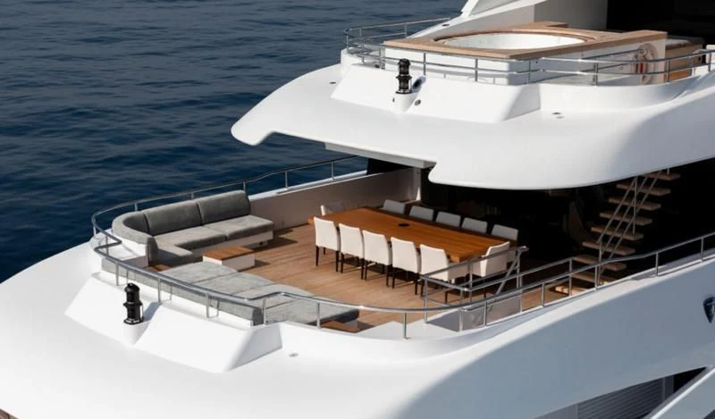 a boat with a table and chairs aboard PEARL Yacht for Sale