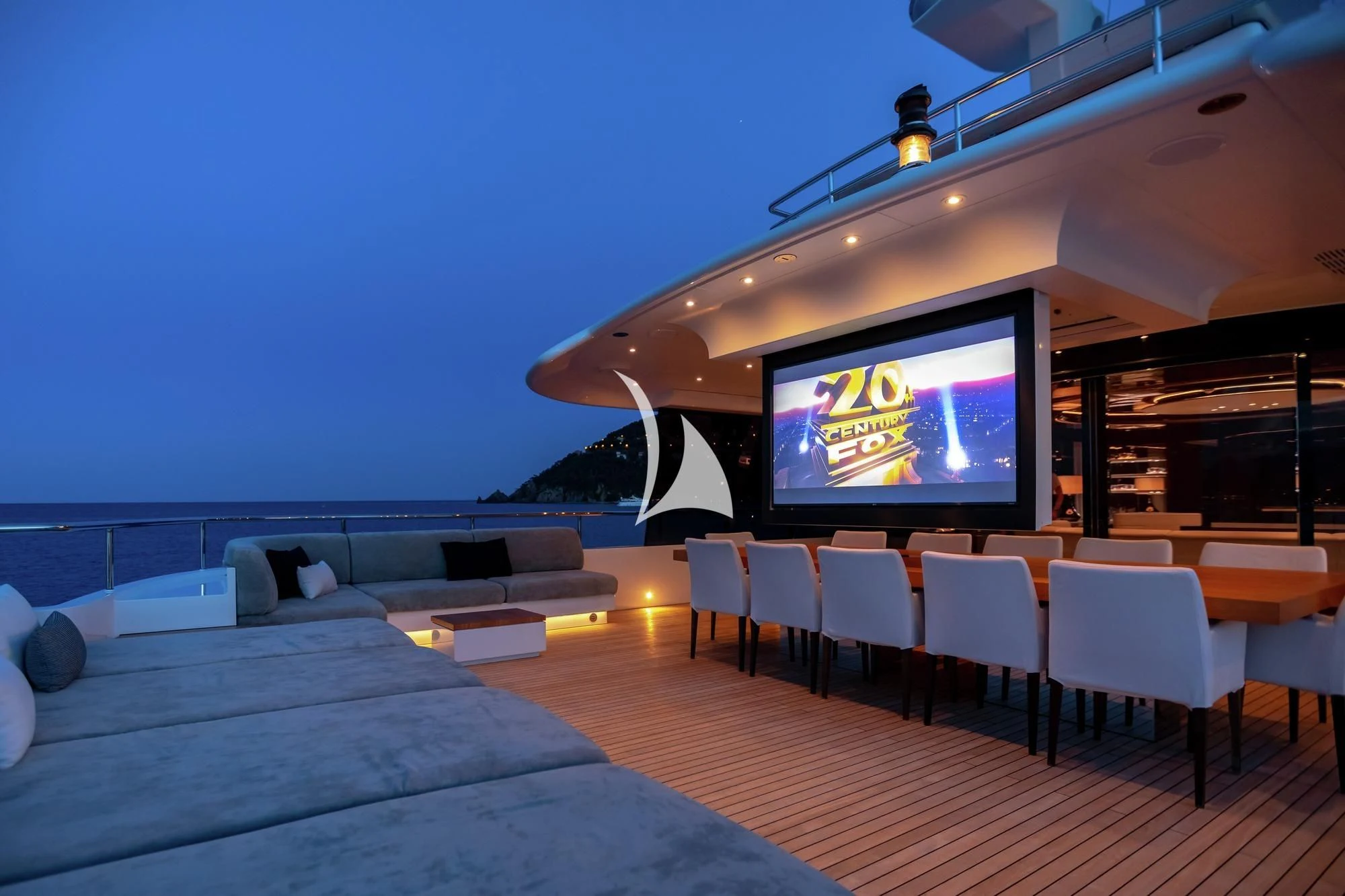 a room with a tv and chairs aboard PEARL Yacht for Sale