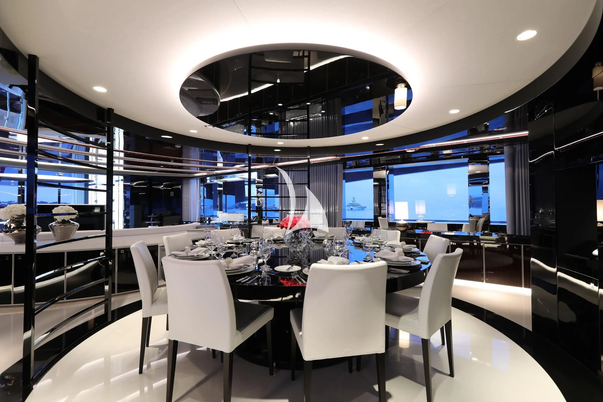 a large room with a table and chairs aboard PEARL Yacht for Sale