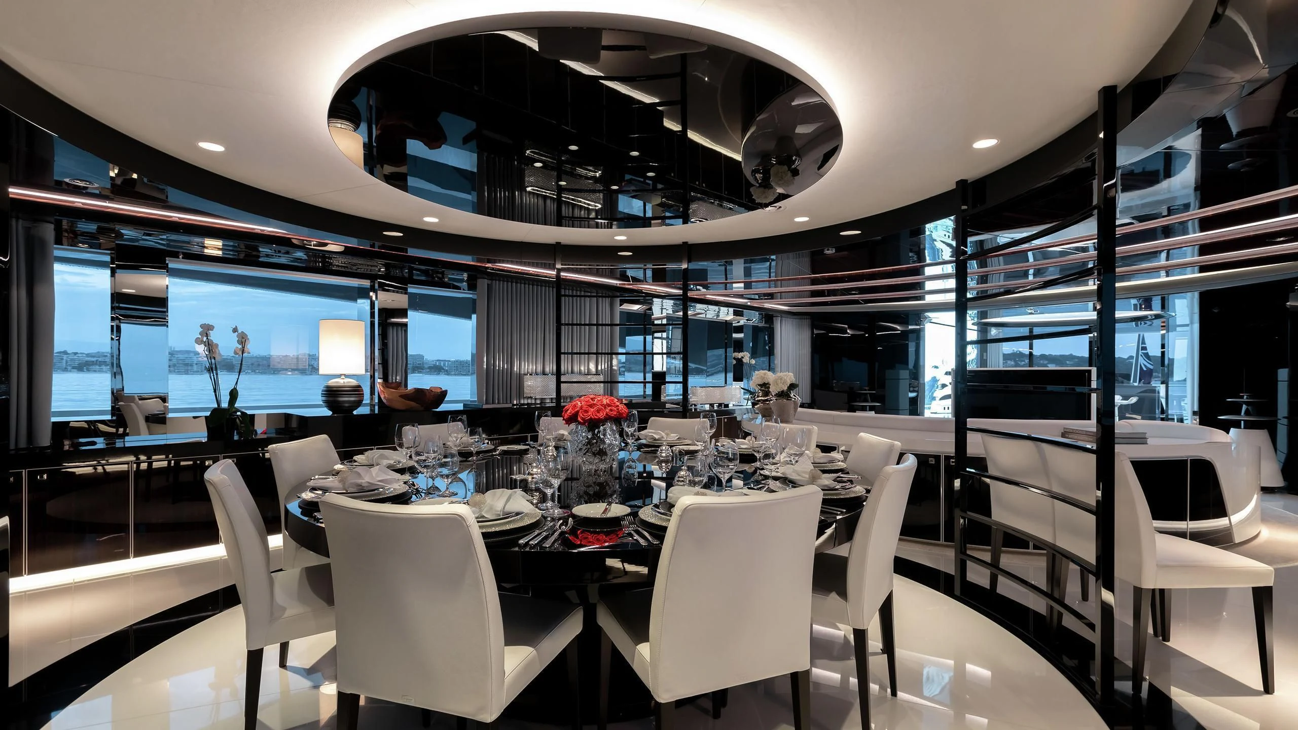 a room with tables and chairs aboard PEARL Yacht for Sale