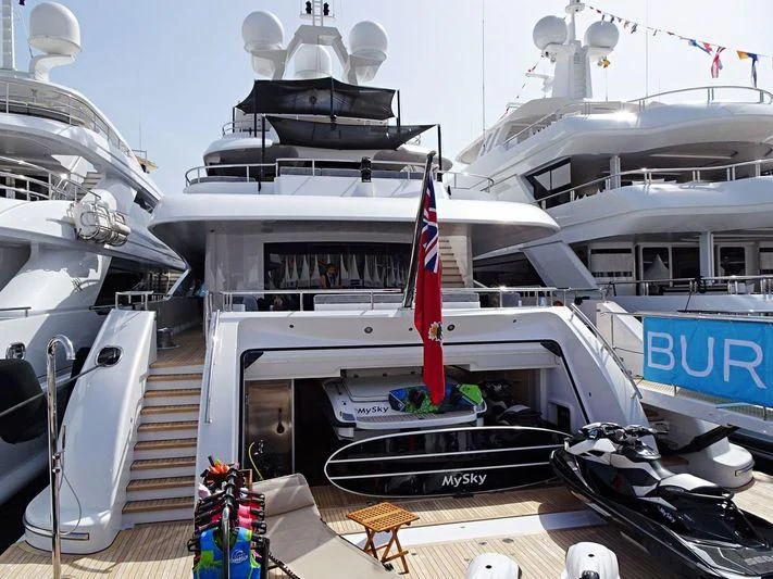 a boat with a flag on the deck aboard PEARL Yacht for Sale