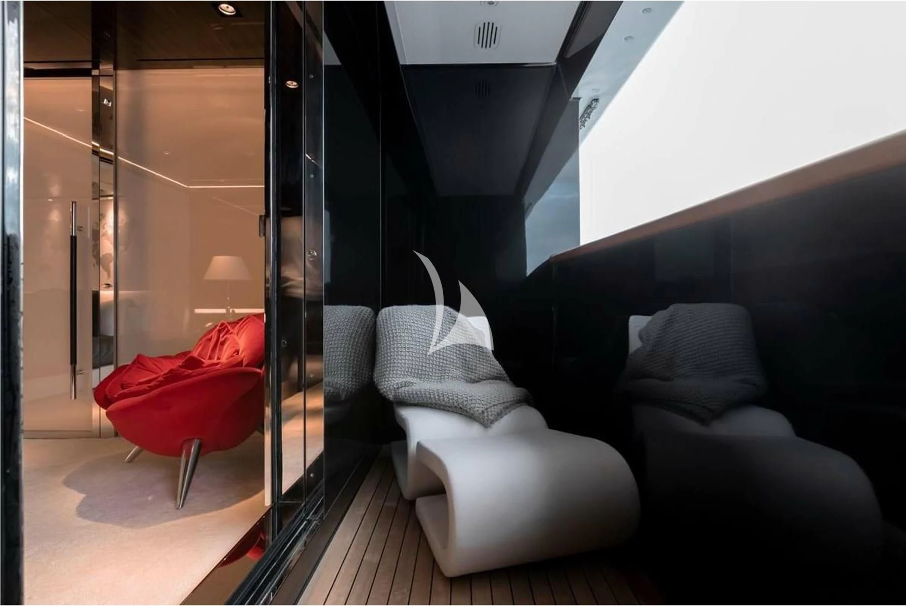 a room with a couch and a chair aboard PEARL Yacht for Sale