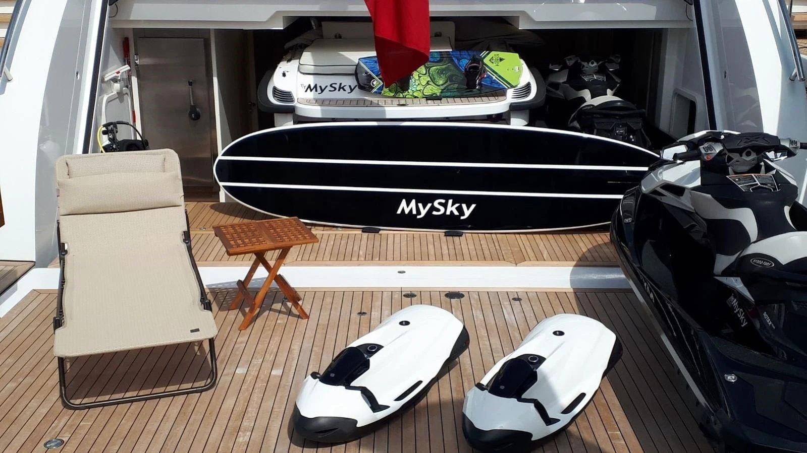 a black and white piano in a room with a wood floor and a wood floor and a white aboard PEARL Yacht for Sale