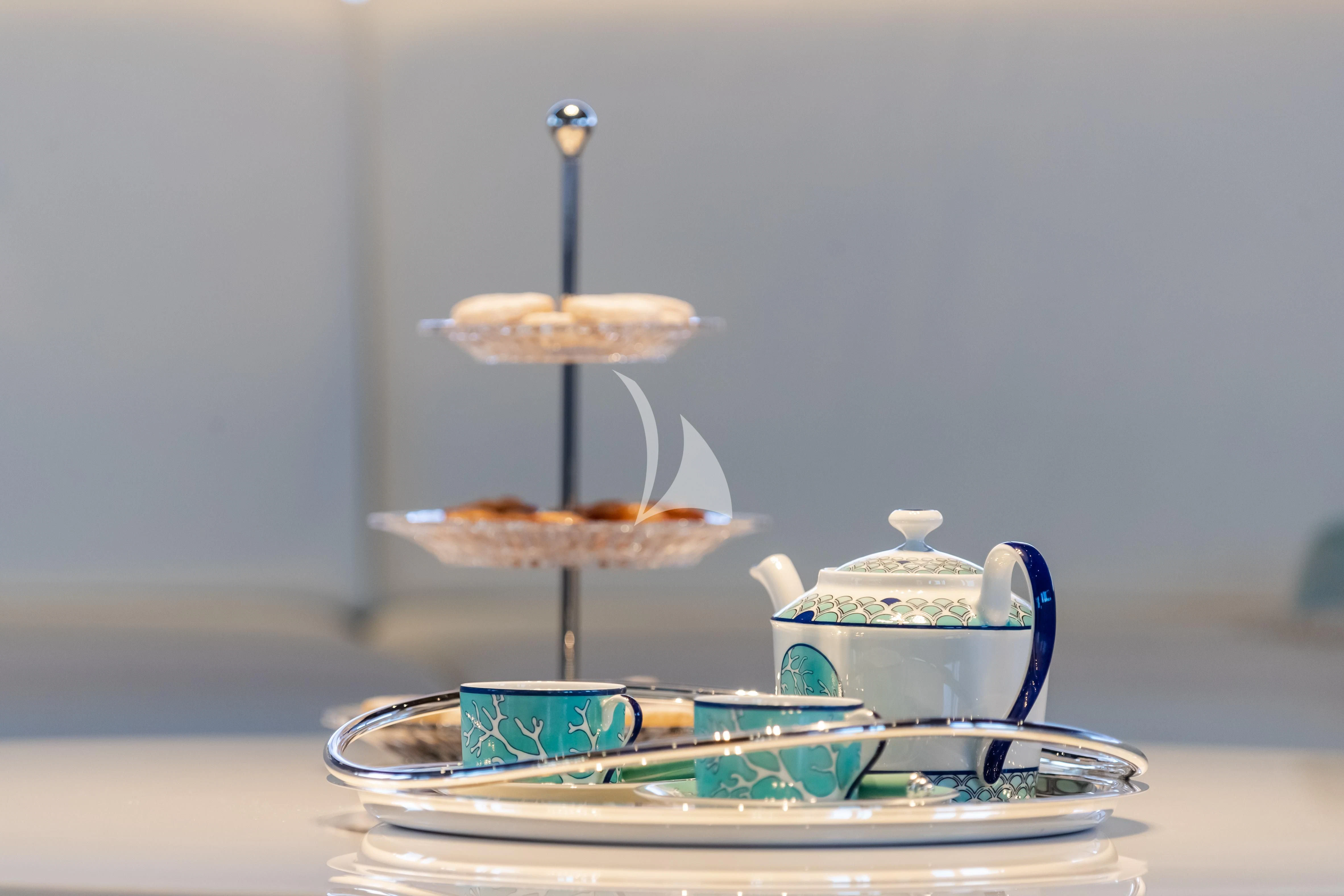 a tea set with tea cups and saucers aboard PEARL Yacht for Sale