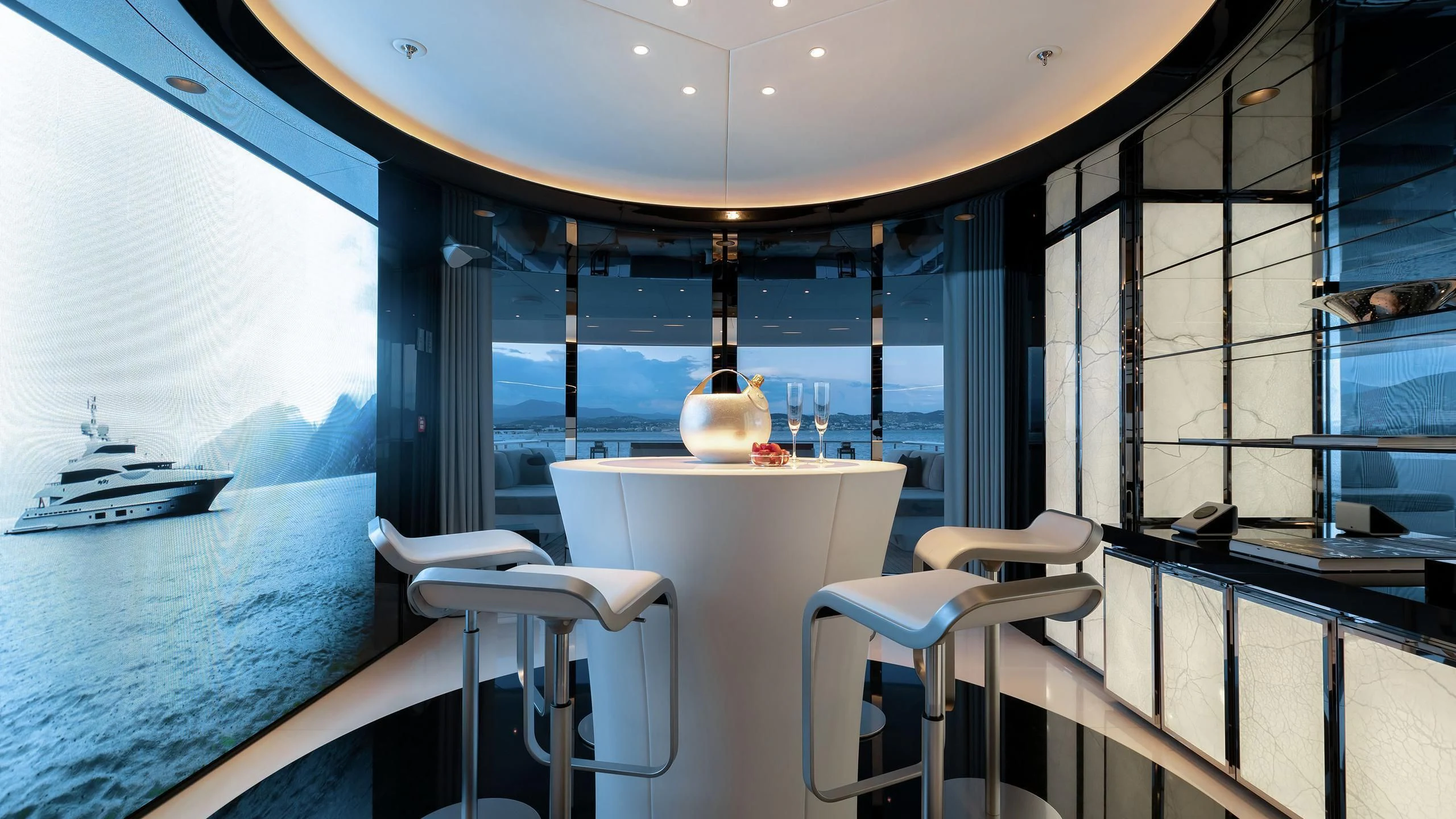 a room with a table and chairs aboard PEARL Yacht for Sale