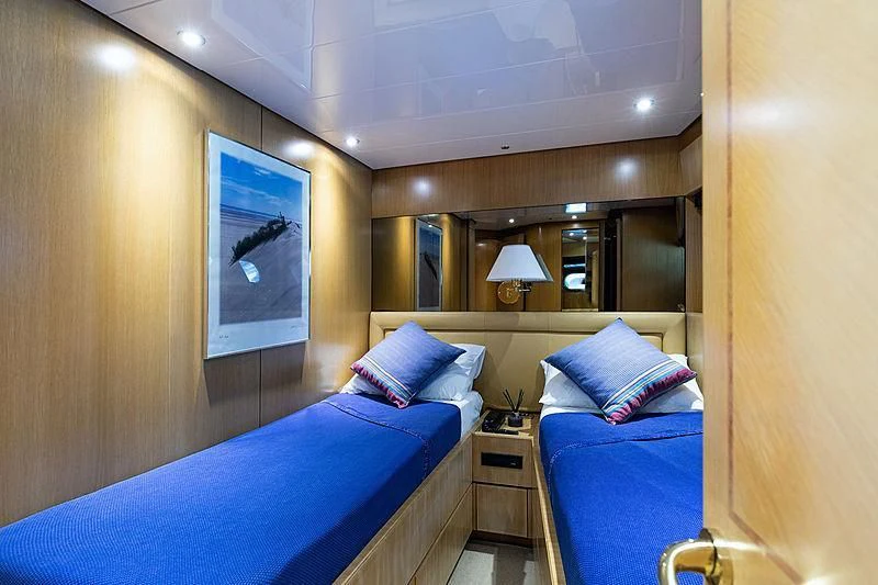 a room with a bed and a mirror aboard GAVEAU Yacht for Sale