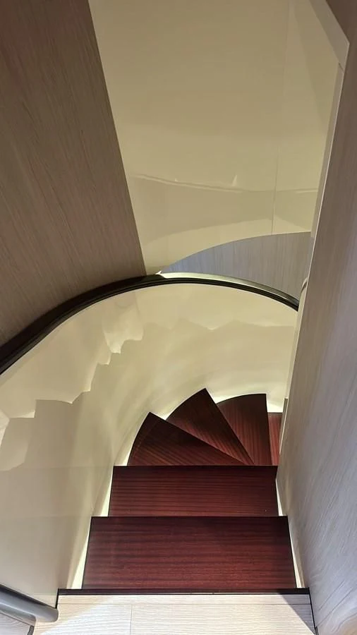 a staircase with a light aboard BETTY Yacht for Sale