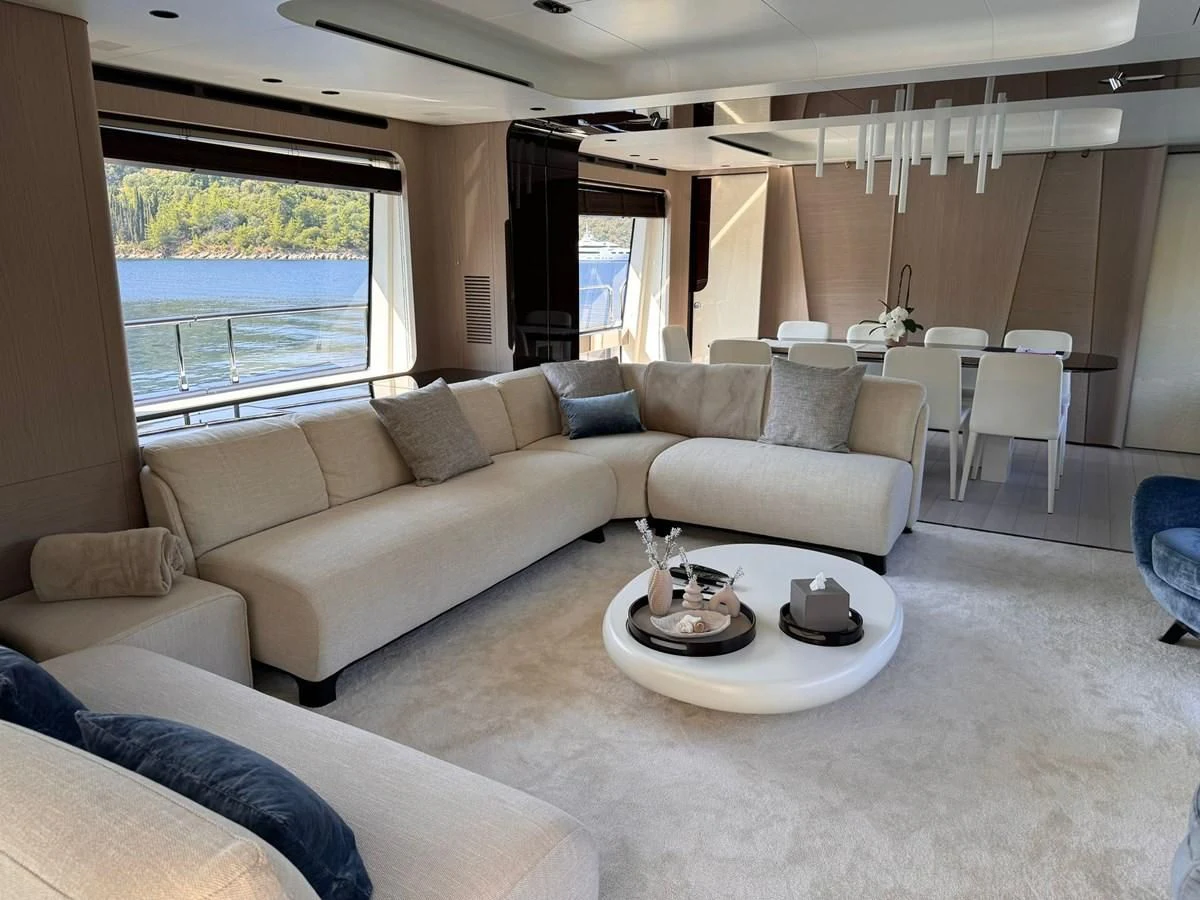 a living room with a couch and a table aboard BETTY Yacht for Sale