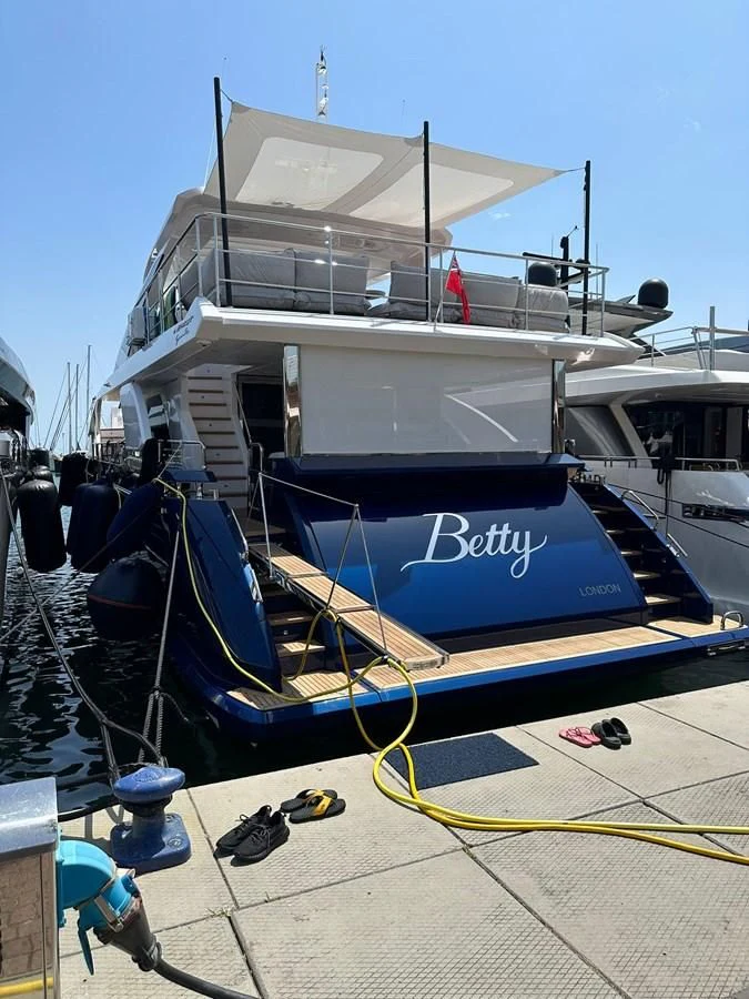a boat docked at a pier aboard BETTY Yacht for Sale