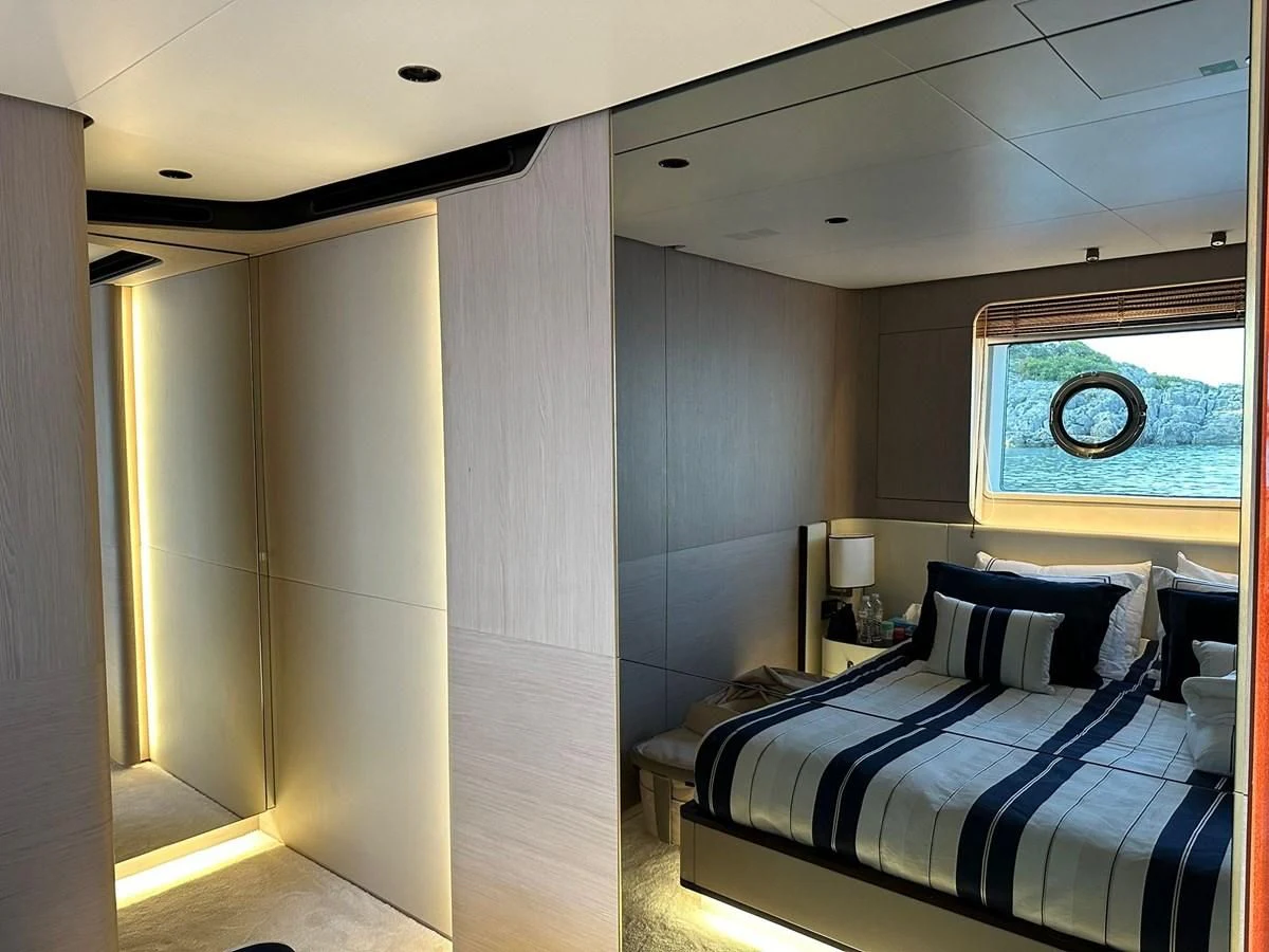 a bedroom with a bed aboard BETTY Yacht for Sale