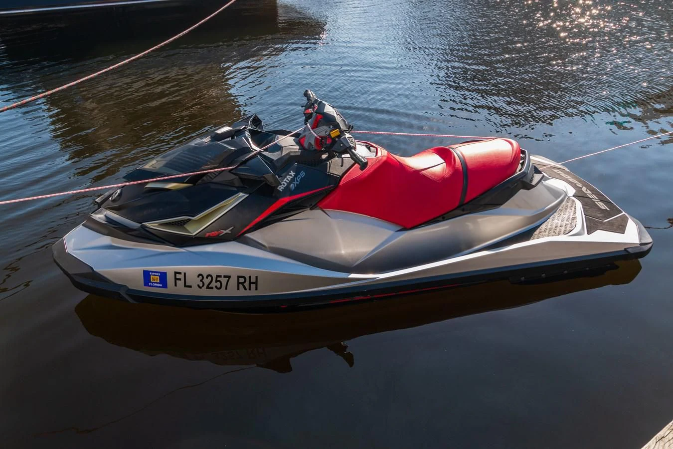 a white and red kayak on a wet beach aboard ASHLEY Yacht for Sale