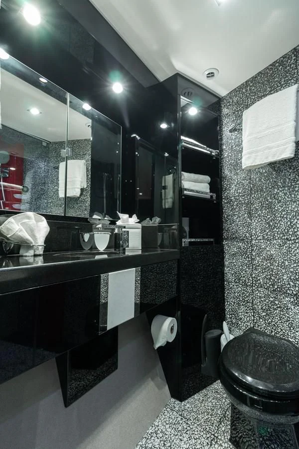 a bathroom with a large mirror aboard ASHLEY Yacht for Sale
