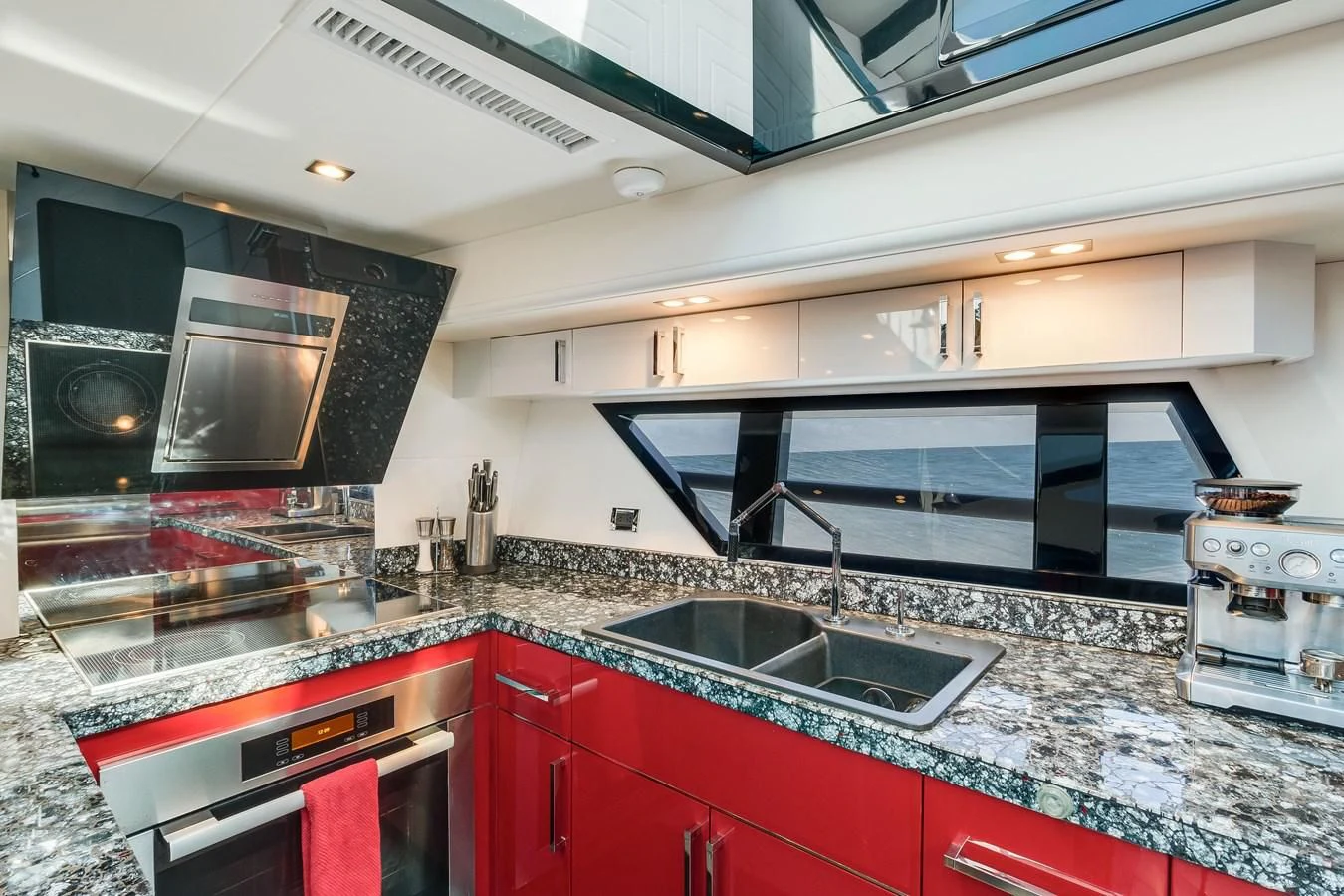 a kitchen with red cabinets aboard ASHLEY Yacht for Sale